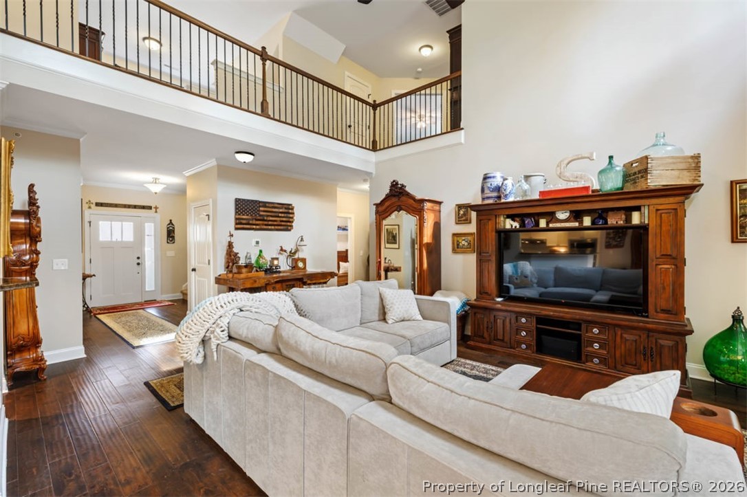48 Valley Brook Lane Spring Lake, NC 28390 - Photo 8 of 50 a living room with furniture and a flat screen tv