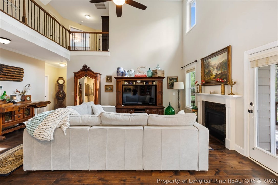 48 Valley Brook Lane Spring Lake, NC 28390 - Photo 9 of 50 a living room with furniture a fireplace and a flat screen tv