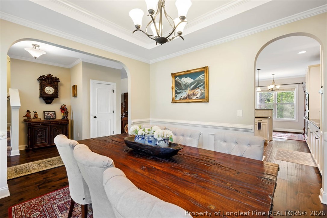48 Valley Brook Lane Spring Lake, NC 28390 - Photo 10 of 50 a dining room with wooden floor and large window