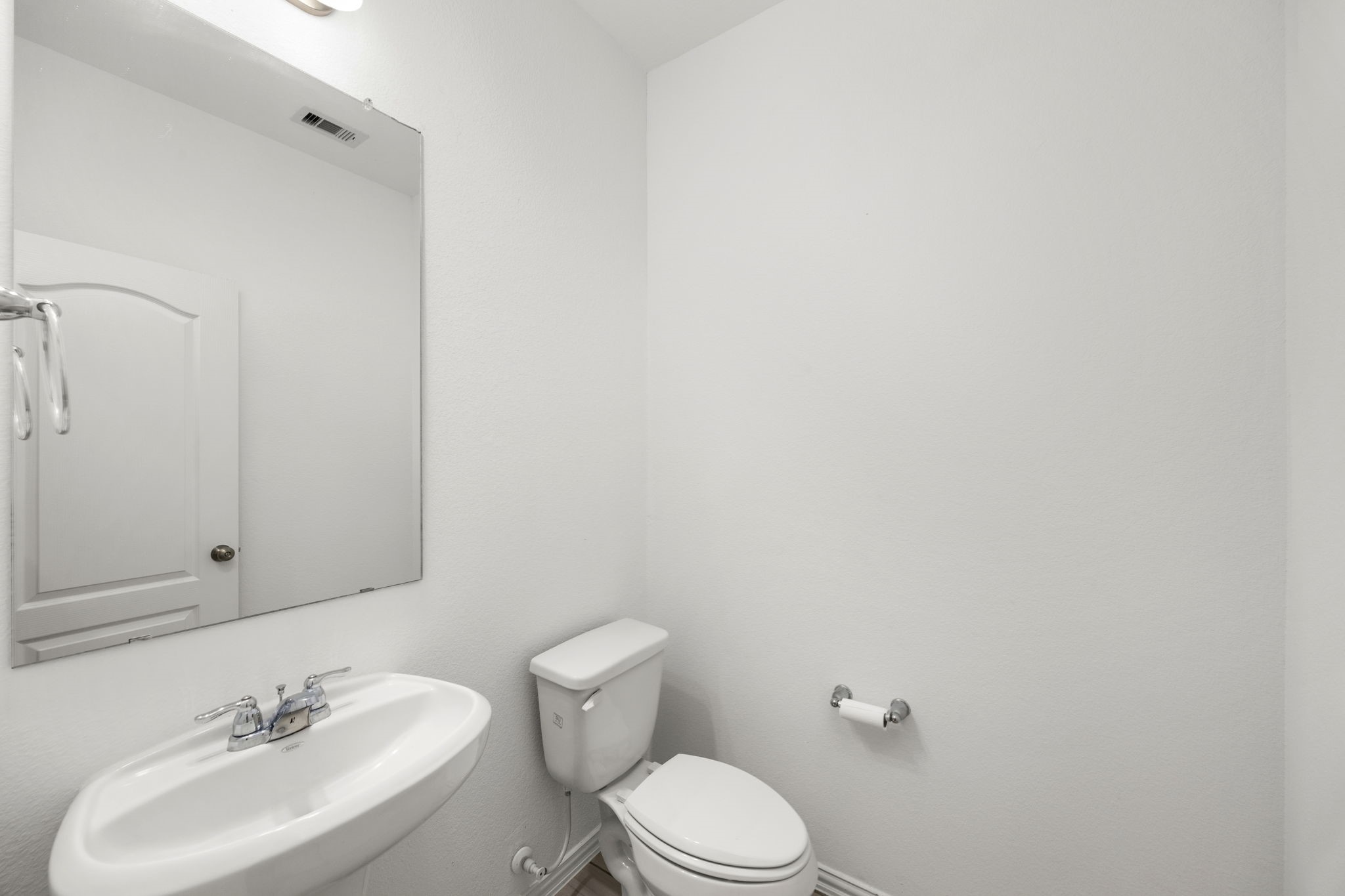 31319 Horseshoe Meadow Bend Lane Fulshear, TX 77441 - Photo 11 of 41 a bathroom with a sink toilet and a mirror