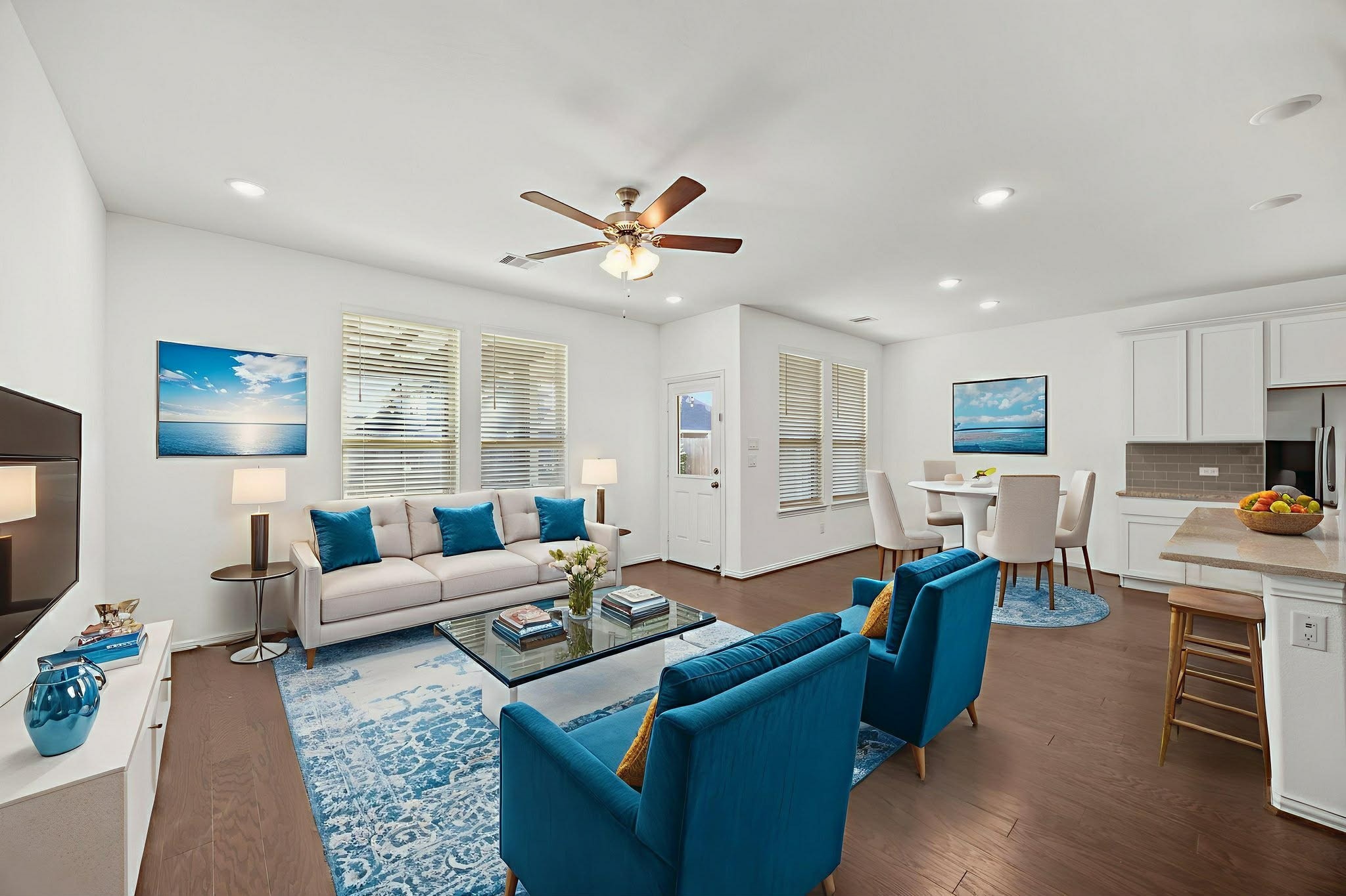 31319 Horseshoe Meadow Bend Lane Fulshear, TX 77441 - Photo 16 of 41 a living room with furniture kitchen view and a large window