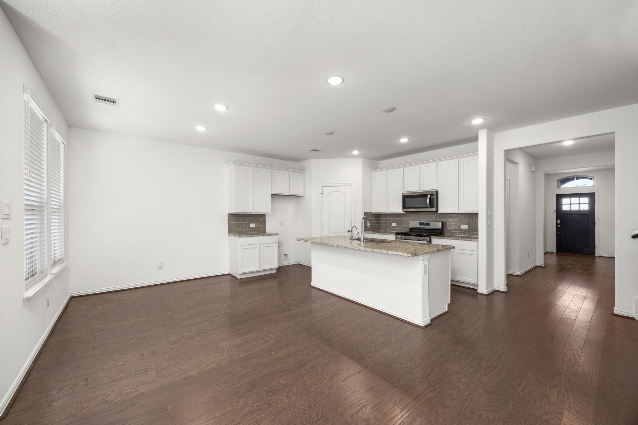 31319 Horseshoe Meadow Bend Lane Fulshear, TX 77441 - Photo 18 of 41 a view of kitchen with refrigerator sink and stove