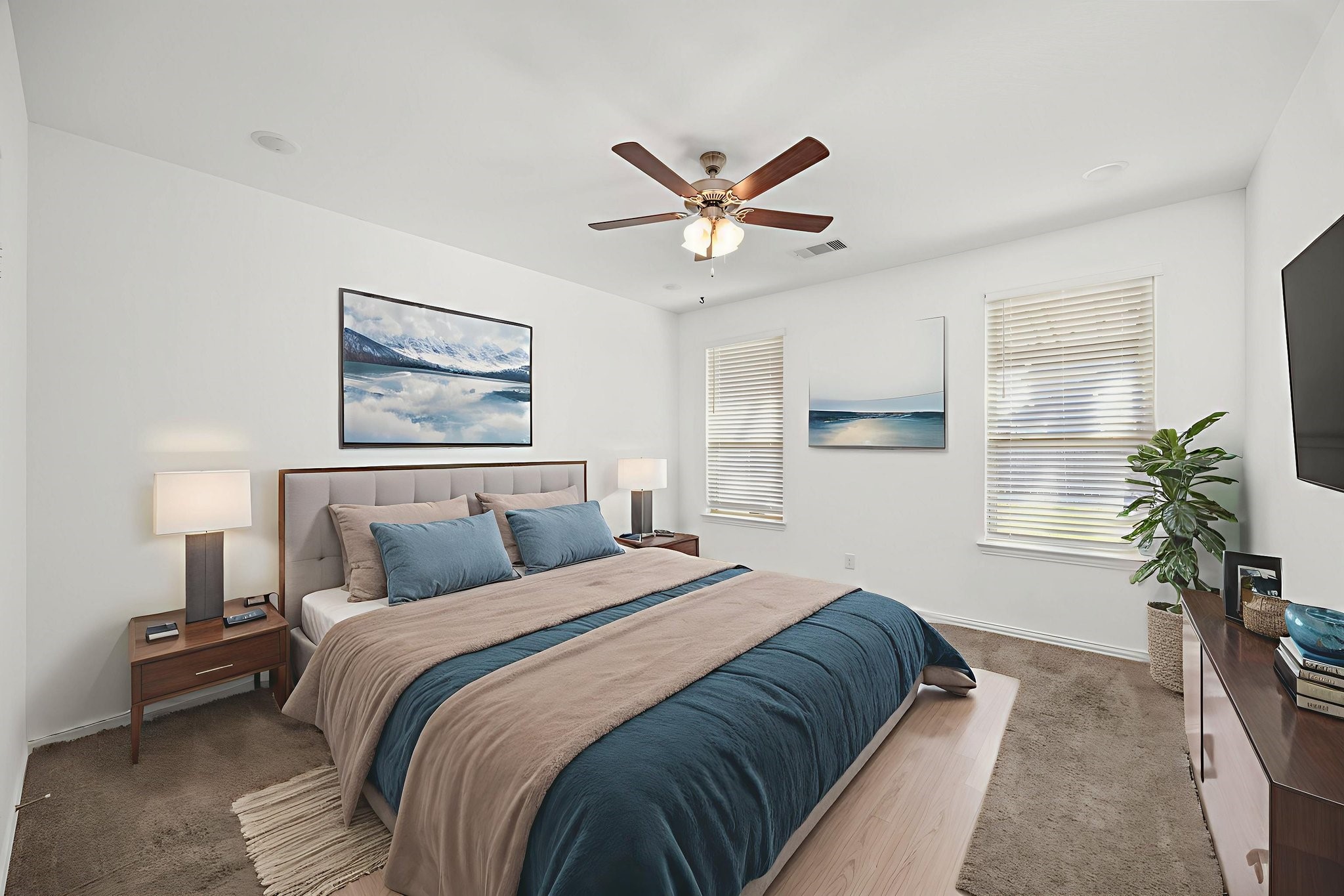 31319 Horseshoe Meadow Bend Lane Fulshear, TX 77441 - Photo 22 of 41 a bedroom with a large bed and a chandelier