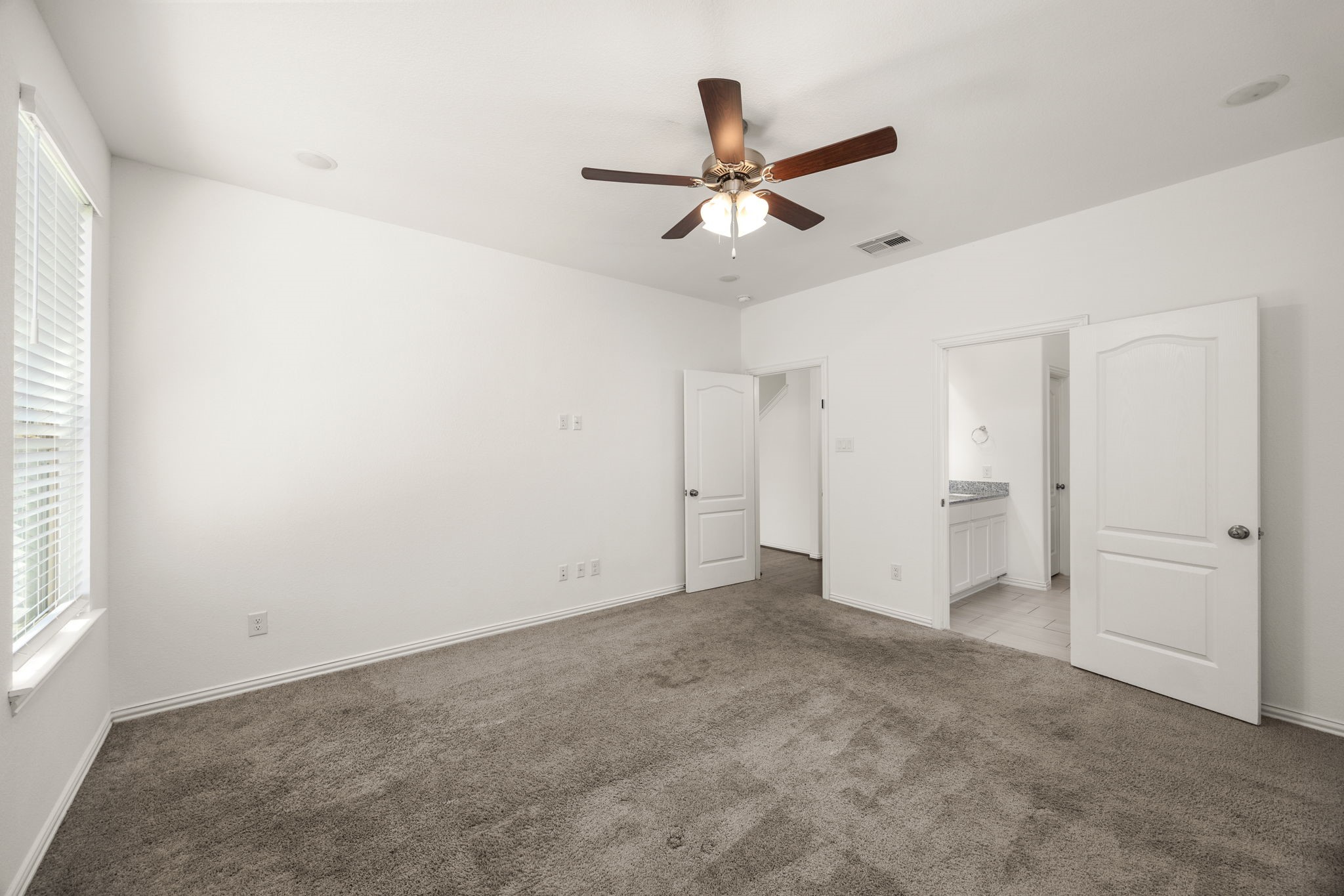 31319 Horseshoe Meadow Bend Lane Fulshear, TX 77441 - Photo 23 of 41 an empty room with closet and a ceiling fan
