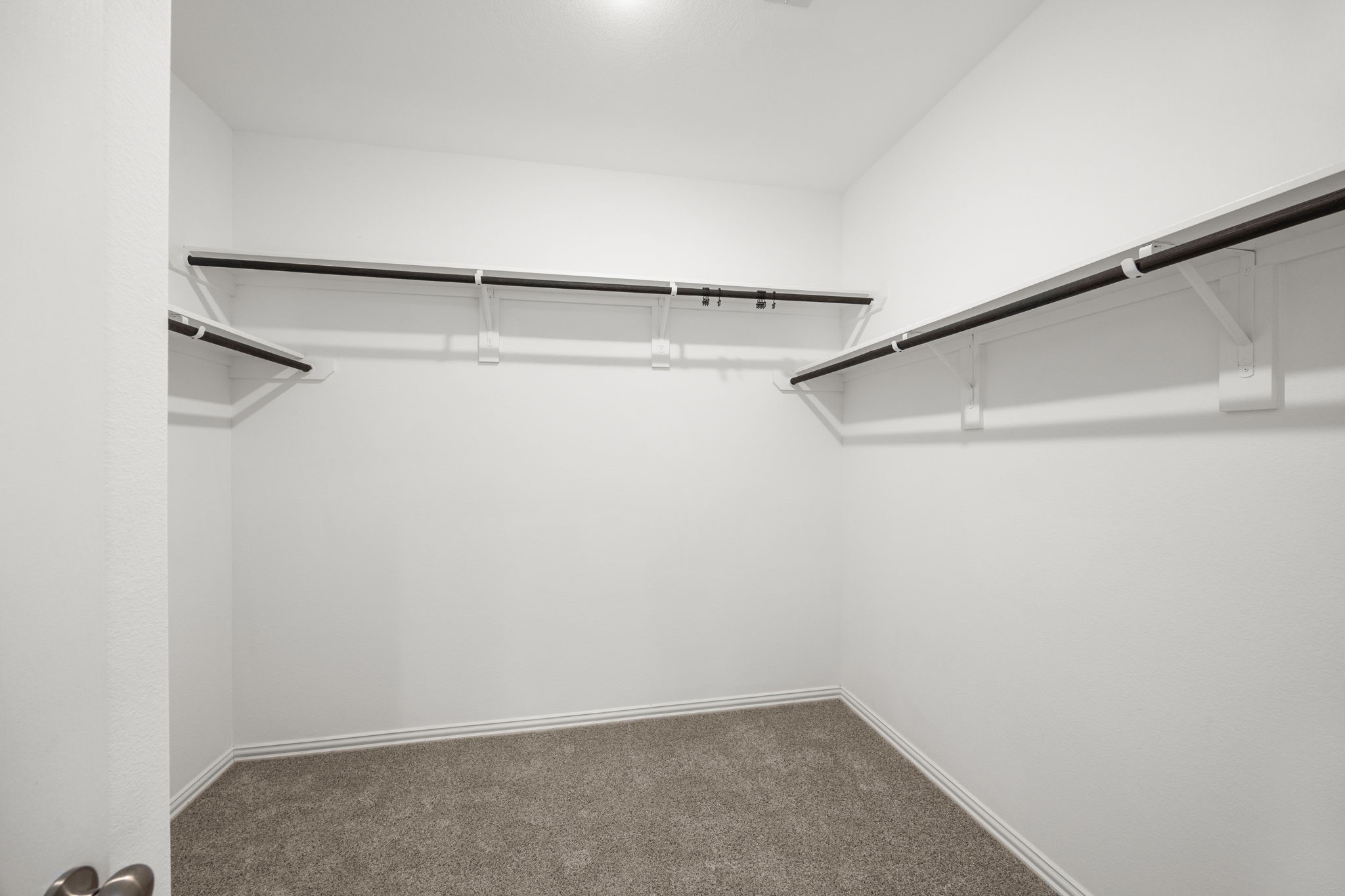 31319 Horseshoe Meadow Bend Lane Fulshear, TX 77441 - Photo 27 of 41 a view of a room with racks on the wall