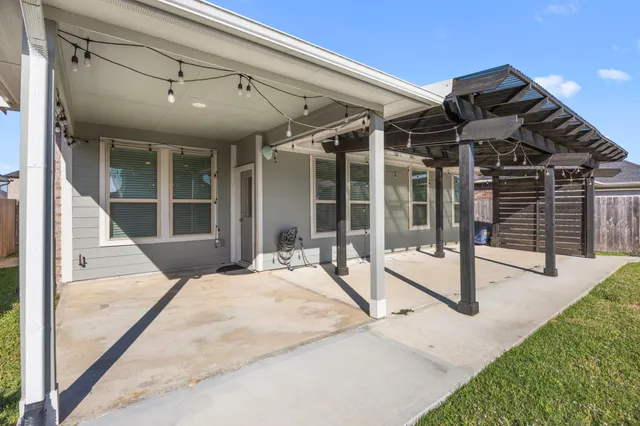 a view of a house with a yard and deck