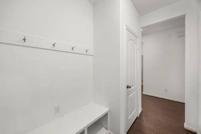 a bathroom with a sink toilet and a mirror