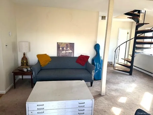 a room with furniture and a rug