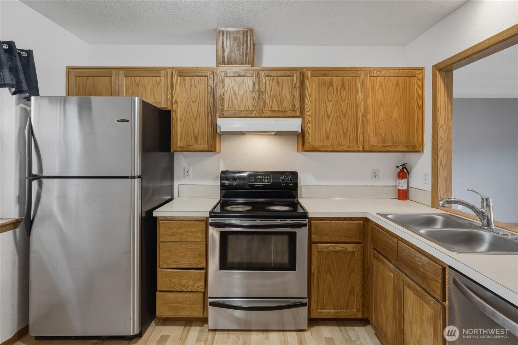 118 Balboa Loop Kelso, WA 98626 - Photo 11 of 35 a kitchen with a stove and a refrigerator