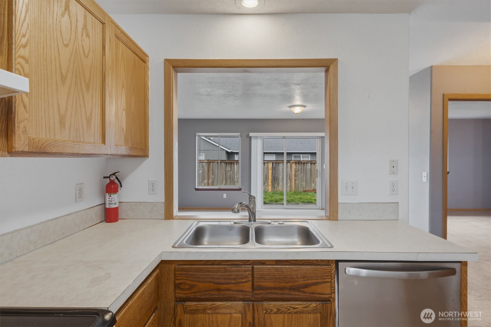 118 Balboa Loop Kelso, WA 98626 - Photo 12 of 35 a kitchen with stainless steel appliances granite countertop a sink and cabinets