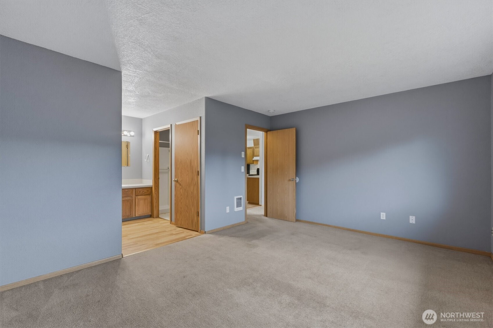 118 Balboa Loop Kelso, WA 98626 - Photo 17 of 35 a view of an empty room with closet and wooden floor