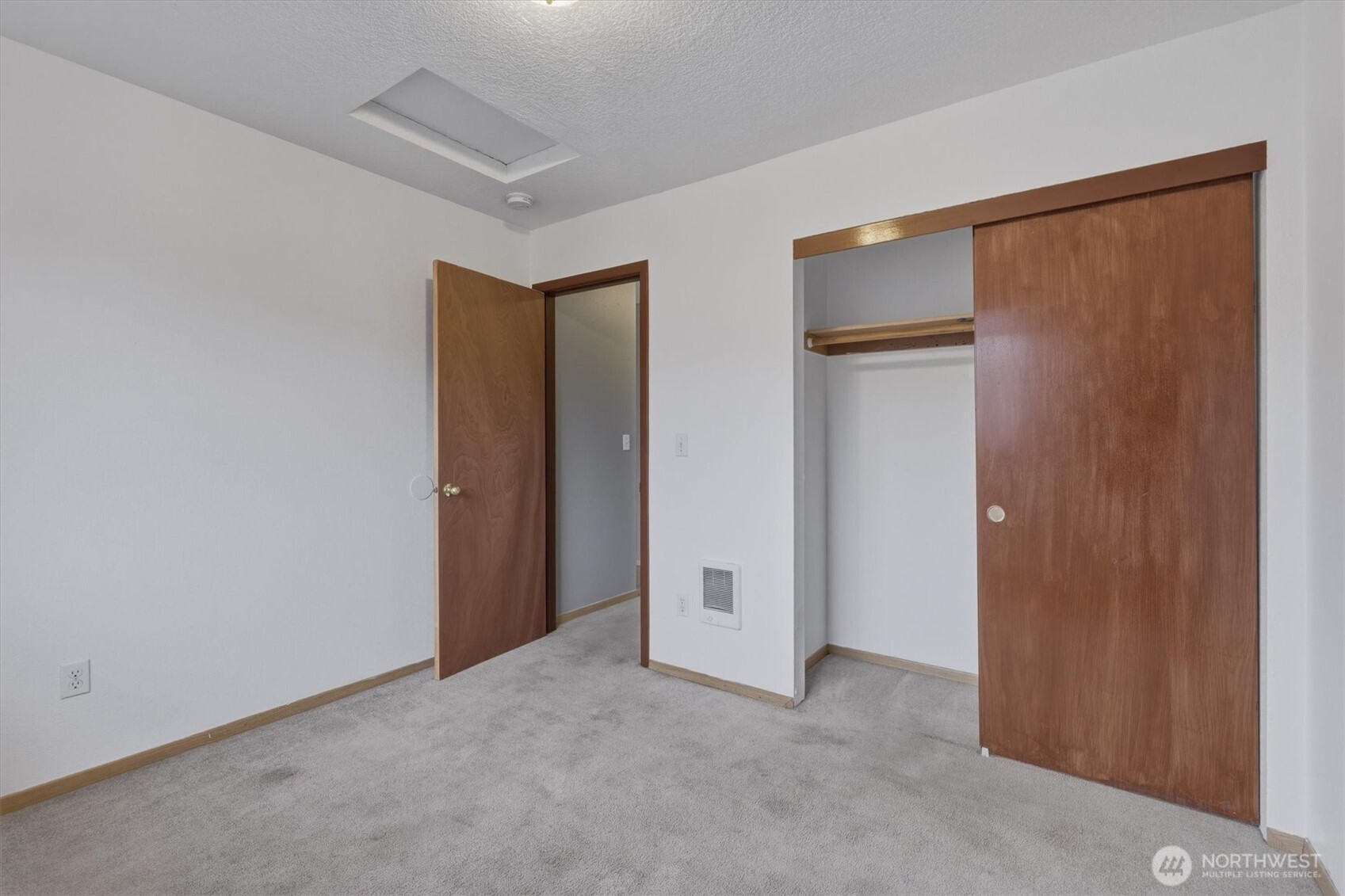 118 Balboa Loop Kelso, WA 98626 - Photo 24 of 35 an empty room with closet and wooden floor