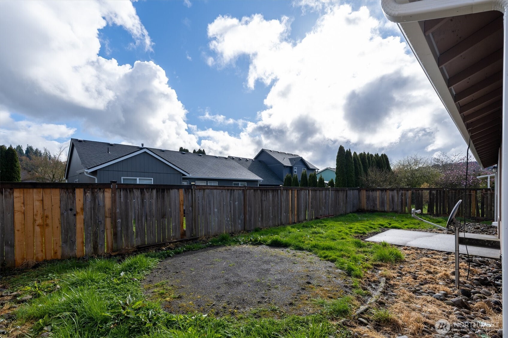 118 Balboa Loop Kelso, WA 98626 - Photo 31 of 35 a view of a backyard with a barbeque grill and wooden fence