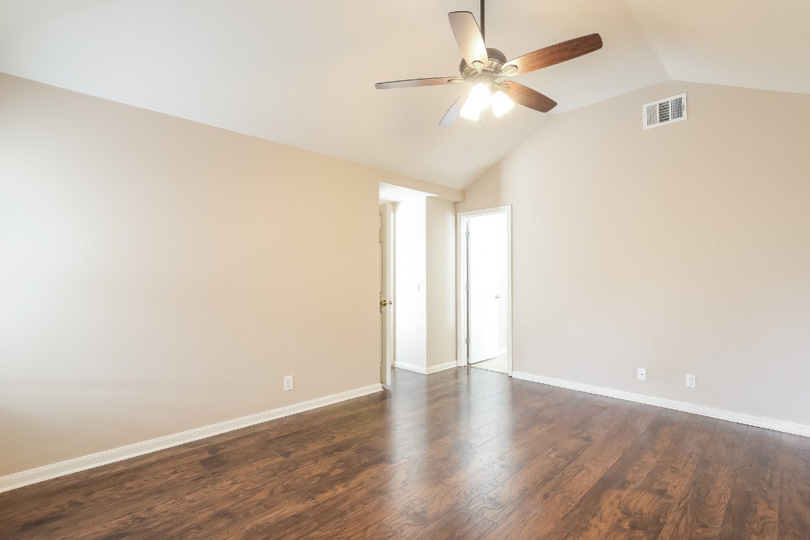 21304 Secretariat Ridge Lane Pflugerville, TX 78660 - Photo 15 of 29 a view of an empty room with wooden floor