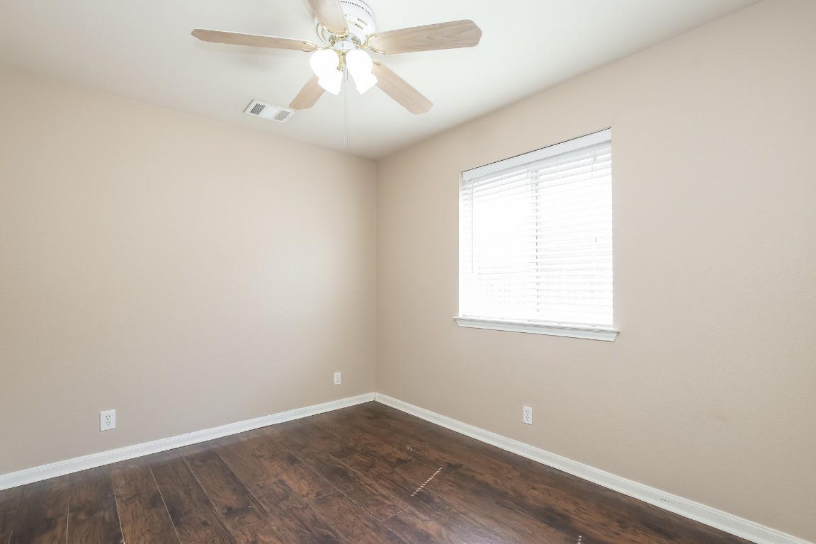 21304 Secretariat Ridge Lane Pflugerville, TX 78660 - Photo 20 of 29 an empty room with a window and a fan