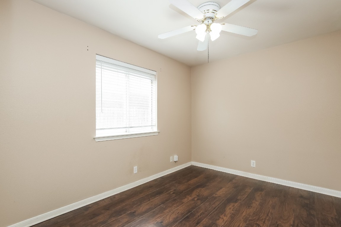 21304 Secretariat Ridge Lane Pflugerville, TX 78660 - Photo 21 of 29 an empty room with a window and a fan