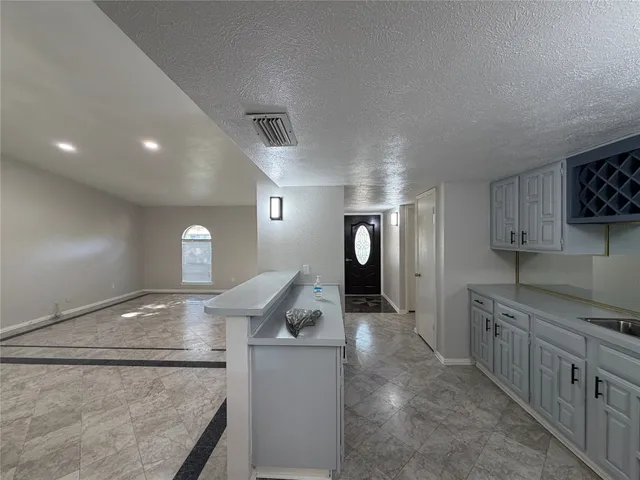 a kitchen with stainless steel appliances granite countertop a sink and a stove