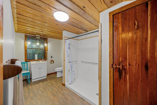 a bathroom with a bathtub and a shower