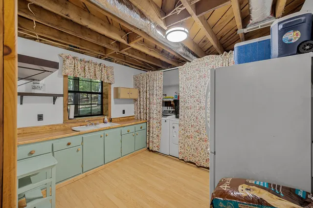 a kitchen with a sink and cabinets