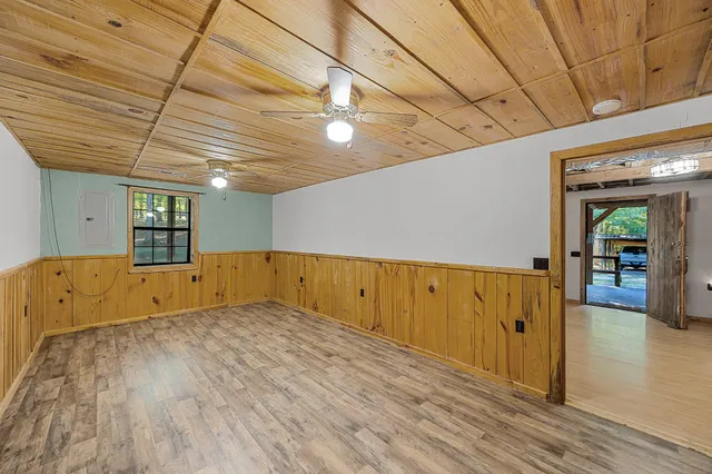 a view of hallway with wooden floor