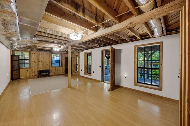 a view of an empty room with closet