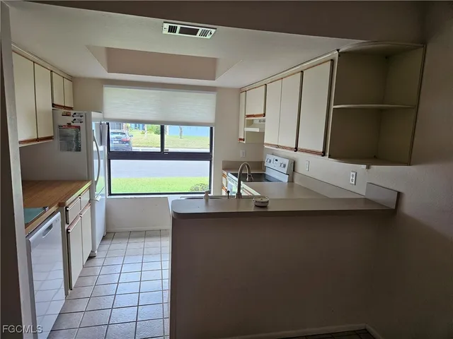 a kitchen with a table and a sink