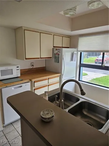 a kitchen with a stove and a sink