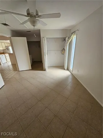 a bathroom with a double vanity sink a toilet and mirror