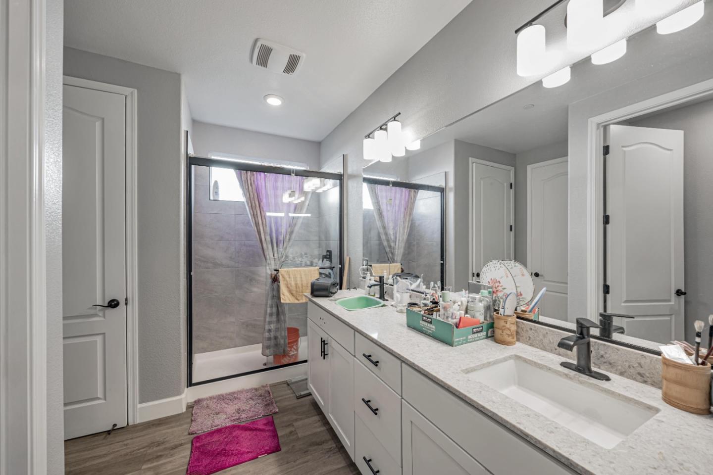 5706 Knight Road Rohnert Park, CA 94928 - Photo 28 of 36 a bathroom with double vanity sinks and a mirror