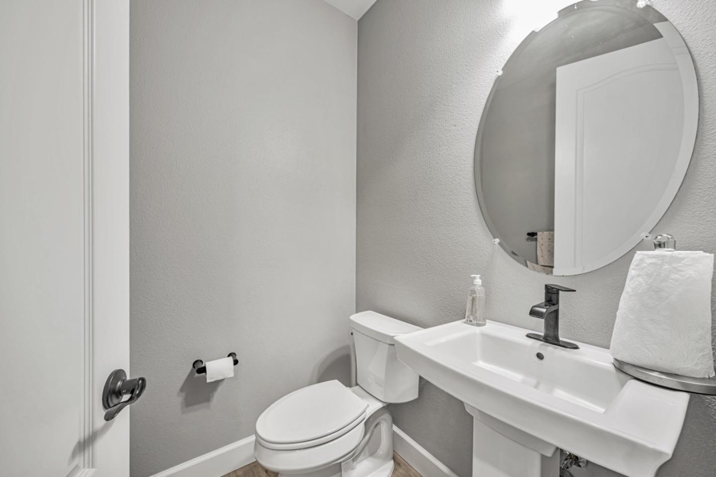 5706 Knight Road Rohnert Park, CA 94928 - Photo 32 of 36 a white toilet sitting next to a bathroom sink