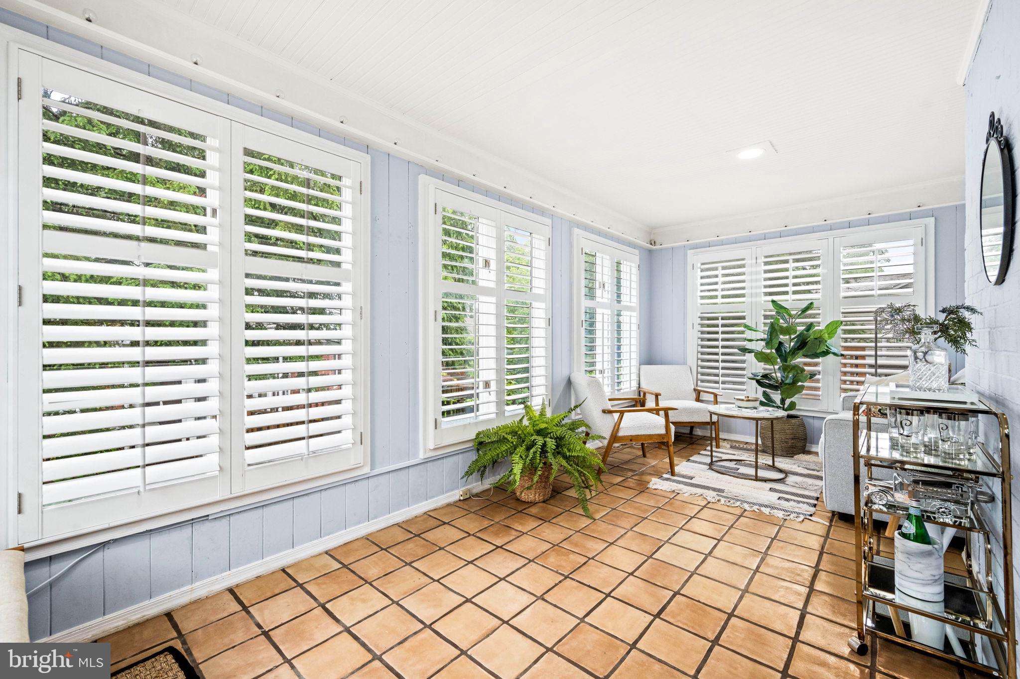 3311 Cameron Mills Road Alexandria, VA 22302 - Photo 6 of 82 Shutters allow for the light to flood in.