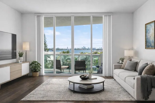 a living room with furniture and a large window