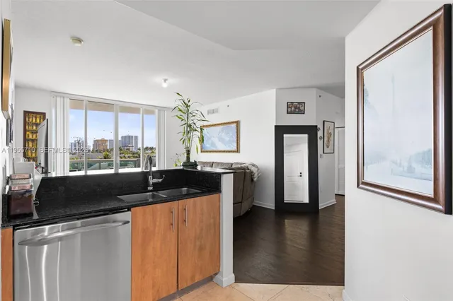 a kitchen with a counter top space and stainless steel appliances