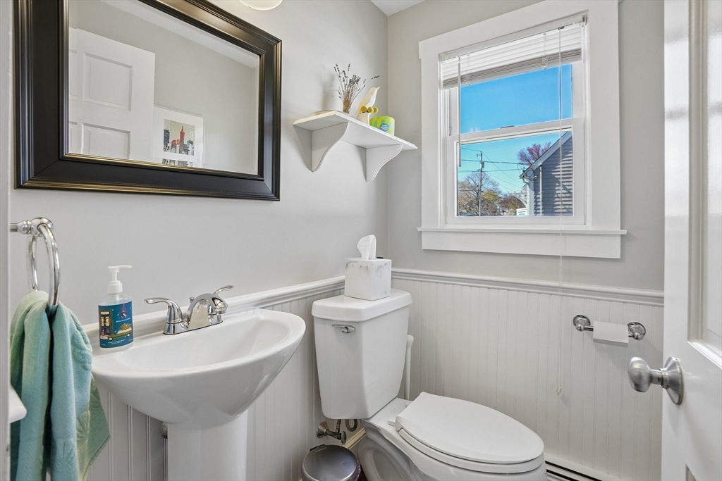 12 Hawley Road Scituate, MA 02066 - Photo 7 of 24 a bathroom with a toilet a sink and mirror