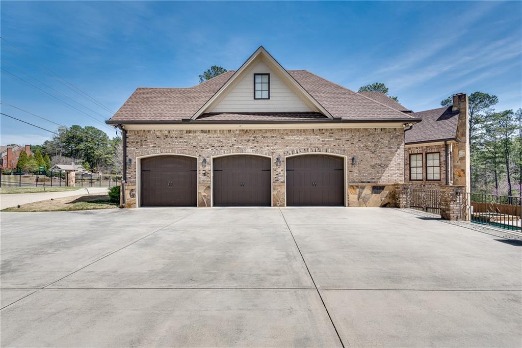 187 Fontaine Road Southwest Mableton, GA 30126 - Photo 5 of 84 a front view of a house with a yard and garage