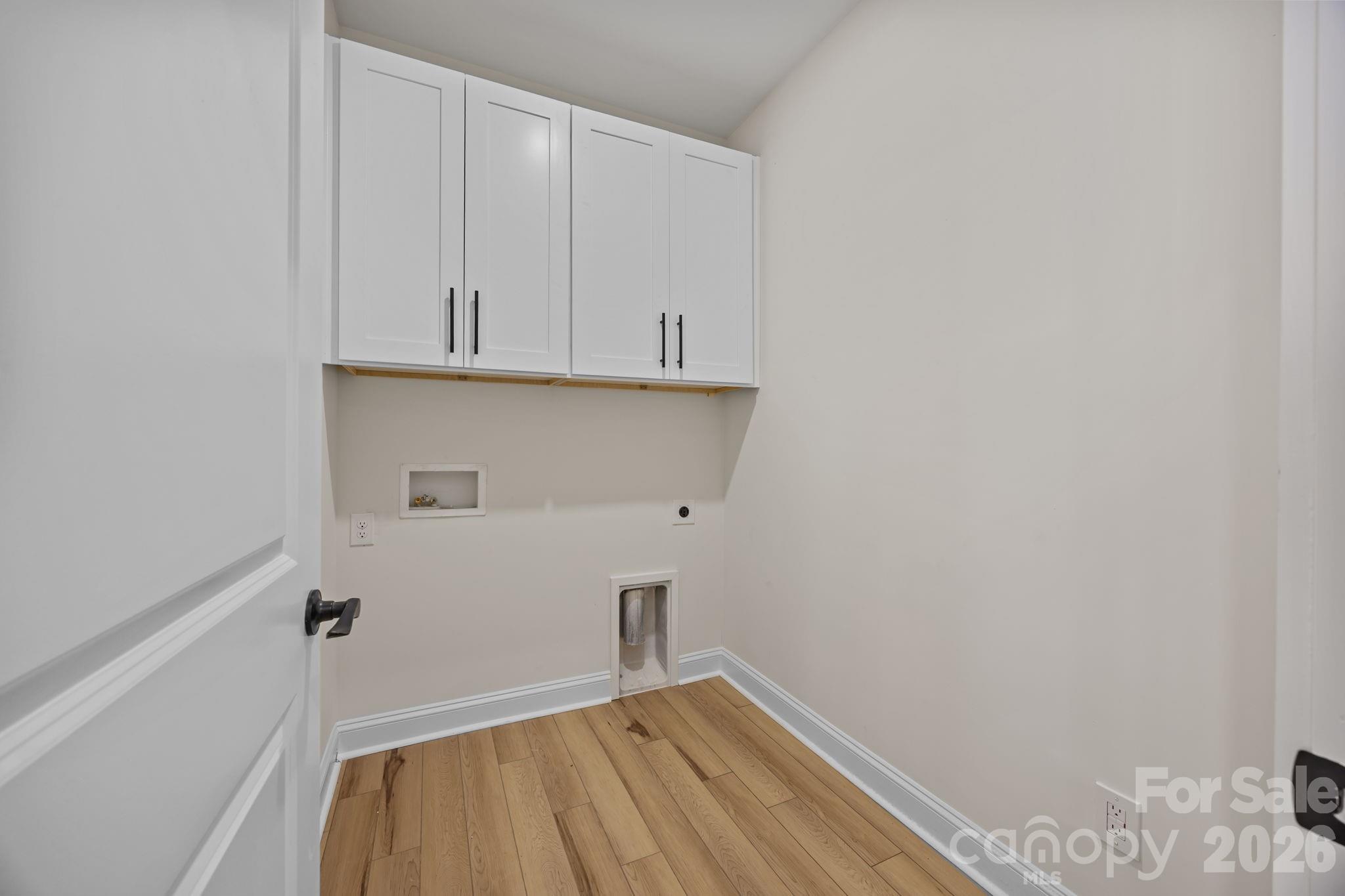 1050 Gibson Road Salisbury, NC 28147 - Photo 25 of 47 a view of storage and utility room with wooden floor