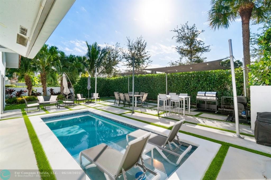 a view of a patio with swimming pool