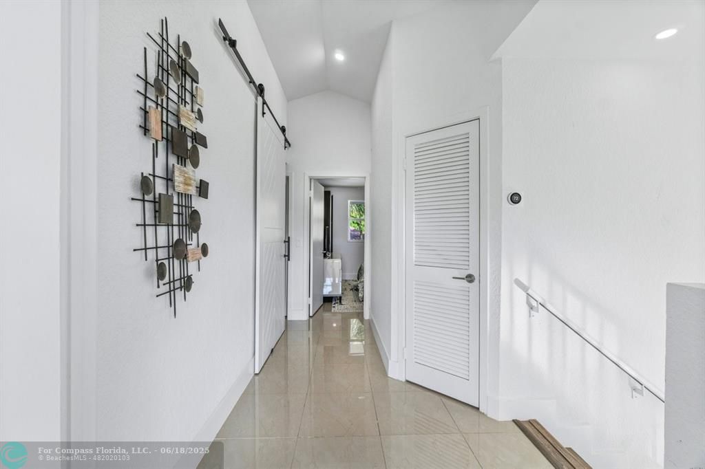 2058 Northwest 52nd Street Boca Raton, FL 33496 - Photo 15 of 35 a view of a hallway with closet