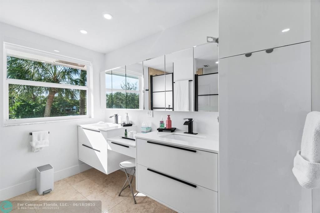 2058 Northwest 52nd Street Boca Raton, FL 33496 - Photo 20 of 35 a room with a window wooden floor and furniture