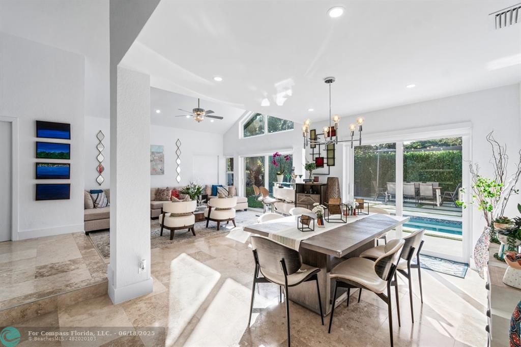 2058 Northwest 52nd Street Boca Raton, FL 33496 - Photo 4 of 35 a living room with furniture kitchen view and a large window