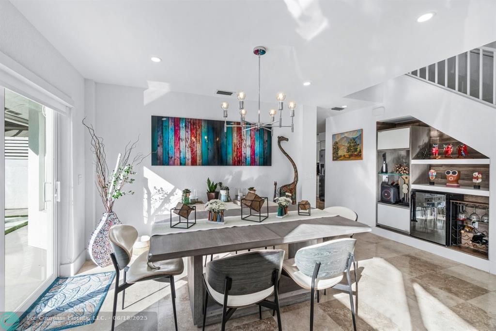 2058 Northwest 52nd Street Boca Raton, FL 33496 - Photo 6 of 35 a view of a a dining room with furniture window and wooden floor