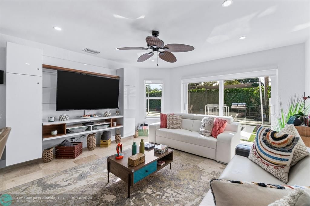 2058 Northwest 52nd Street Boca Raton, FL 33496 - Photo 10 of 35 a living room with furniture and a flat screen tv