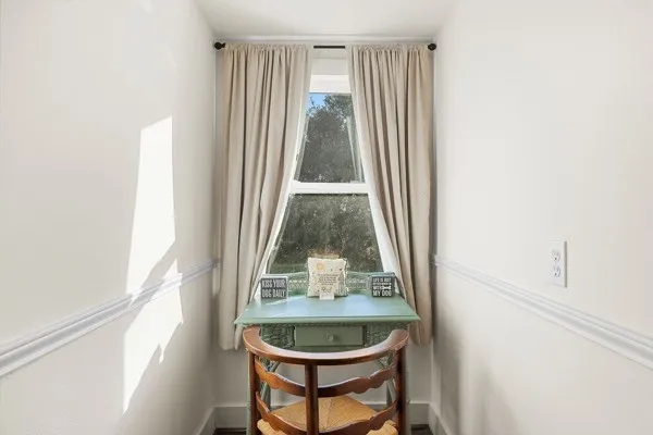 a room with a window and couch