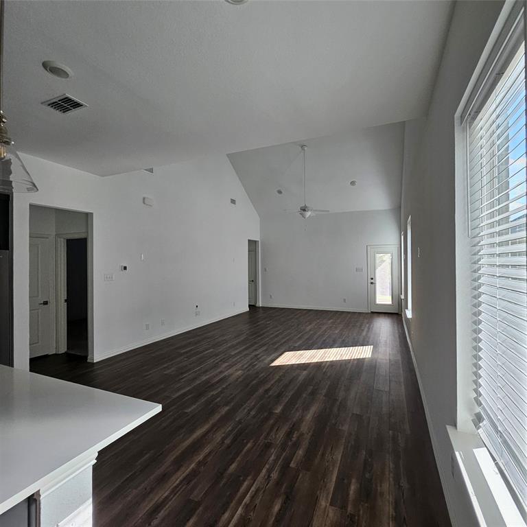 2309 Jack Rabbit Way Northlake, TX 76247 - Photo 5 of 28 Expansive living area featuring vaulted ceilings, wood-finish flooring, recessed lighting, and a ceiling fan