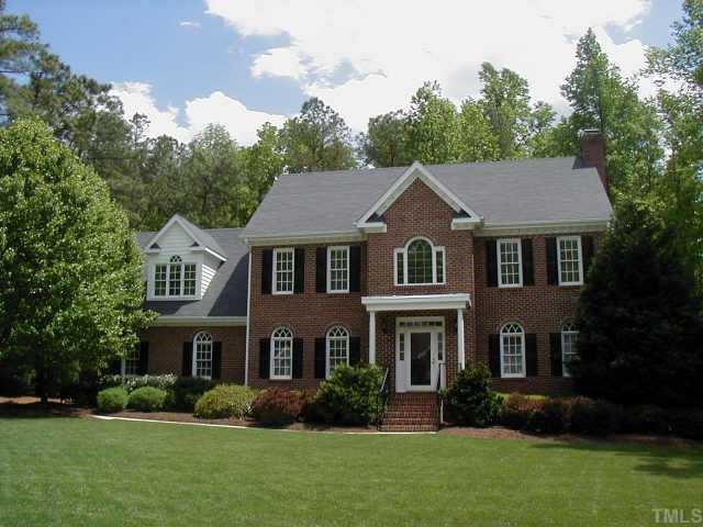 8908 Oxbridge Court Raleigh, NC 27613 - Photo 1 of 1 a front view of a house with a garden and plants