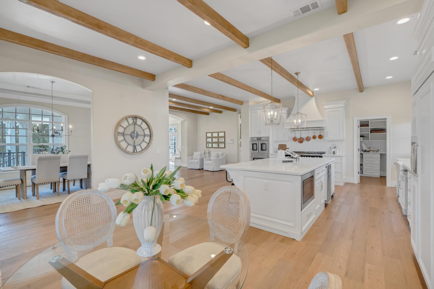 2905 Virginiatown Road Lincoln, CA 95648 - Photo 13 of 86 Expansive kitchen featuring a large central island with integrated microwave, white cabinetry, and stainless steel appliances