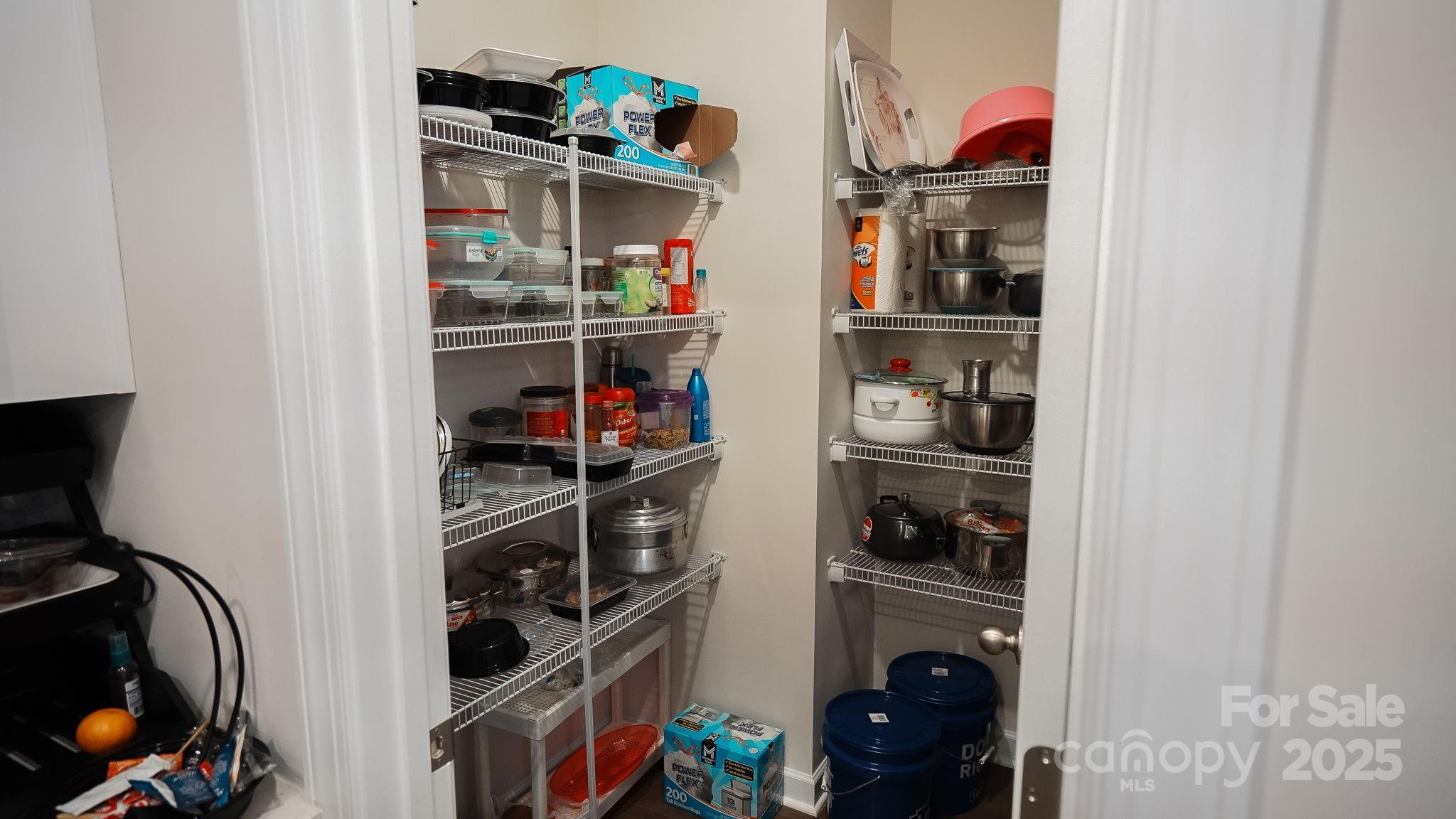 486 Olympia Way York, SC 29745 - Photo 12 of 34 a view of walk in closet with clothes and shoes