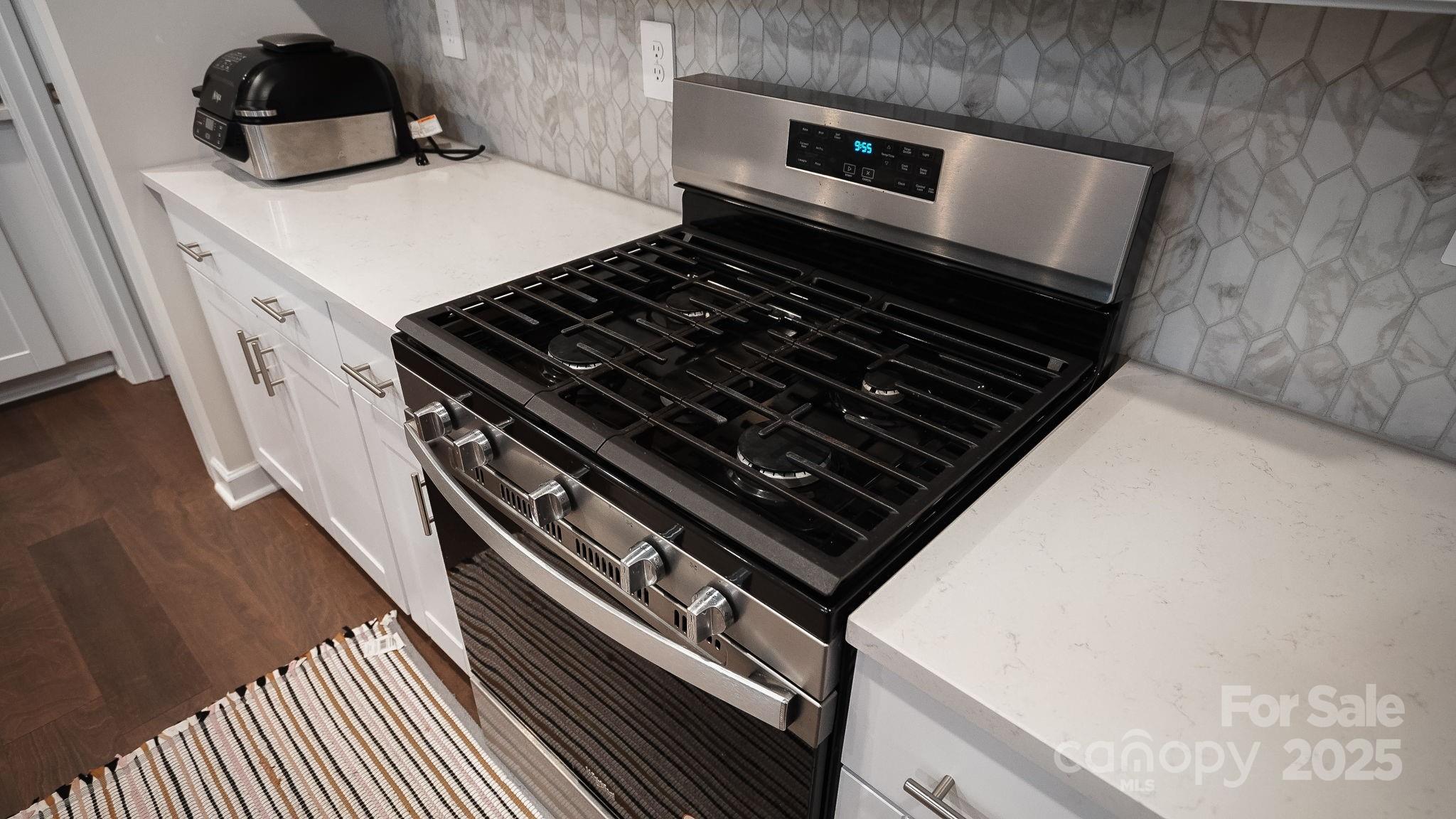 486 Olympia Way York, SC 29745 - Photo 13 of 34 a stove top oven sitting inside of a kitchen