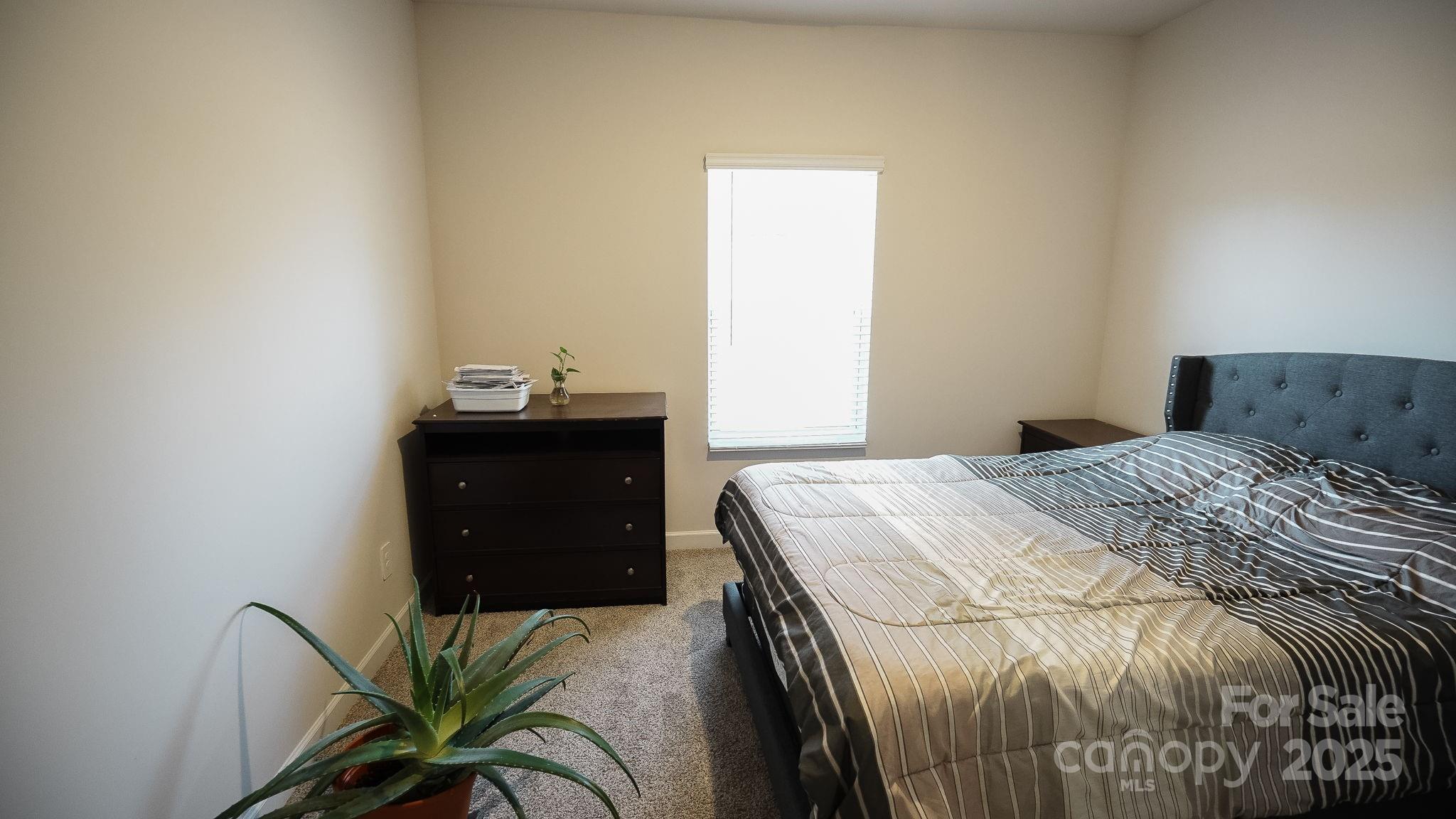 486 Olympia Way York, SC 29745 - Photo 17 of 34 a bedroom with a bed and a dresser