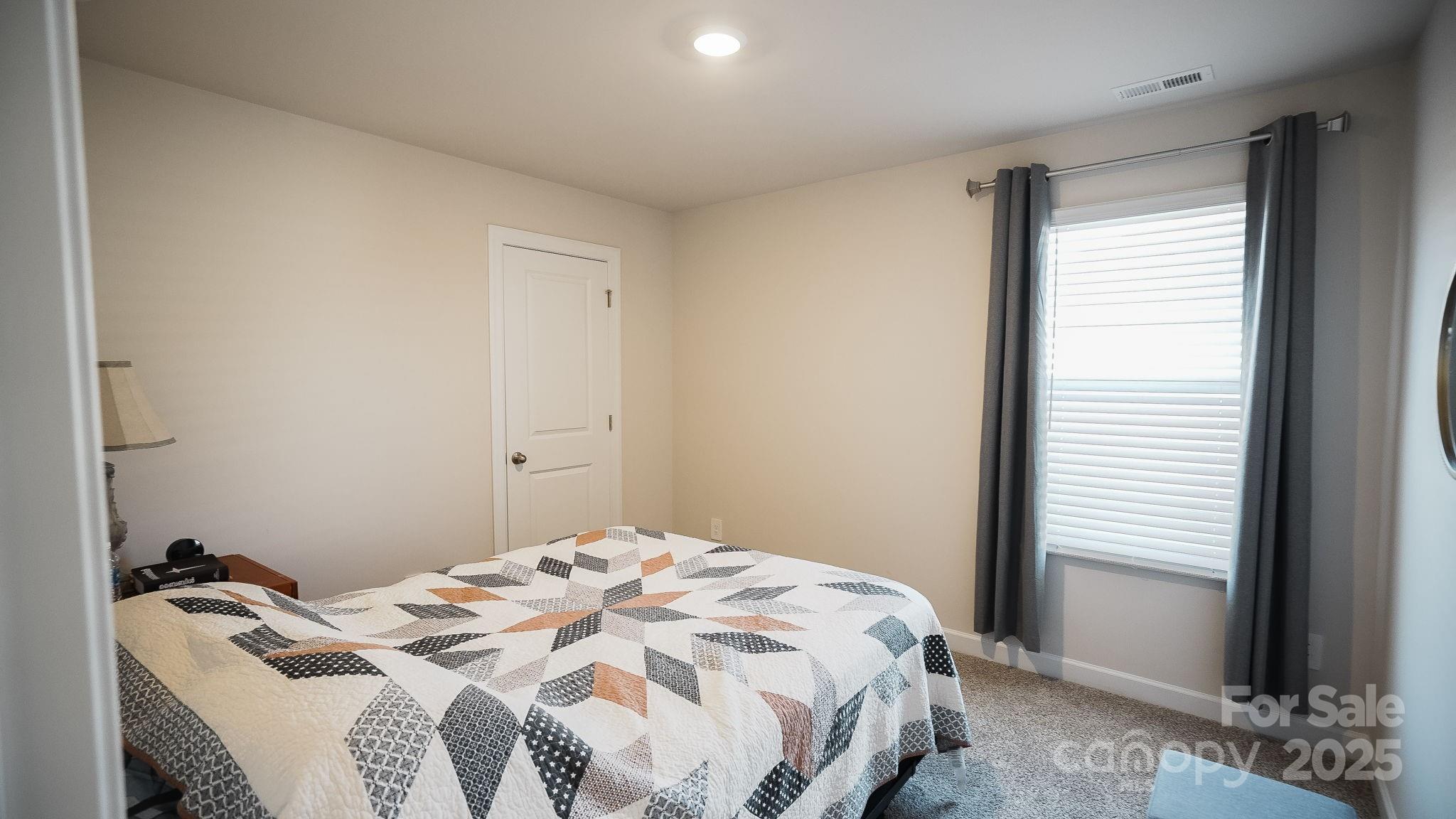 486 Olympia Way York, SC 29745 - Photo 22 of 34 a bedroom with a bed and a window